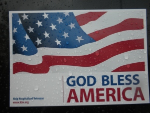 GOD BLESS AMERICA car magnet on a rainy day in Kansas. The rain drops reminded me of tear drops for our fallen and wounded troops as they battle for our freedom in today's wars. 6-12-10-Sat.-Overland Park, Kansas